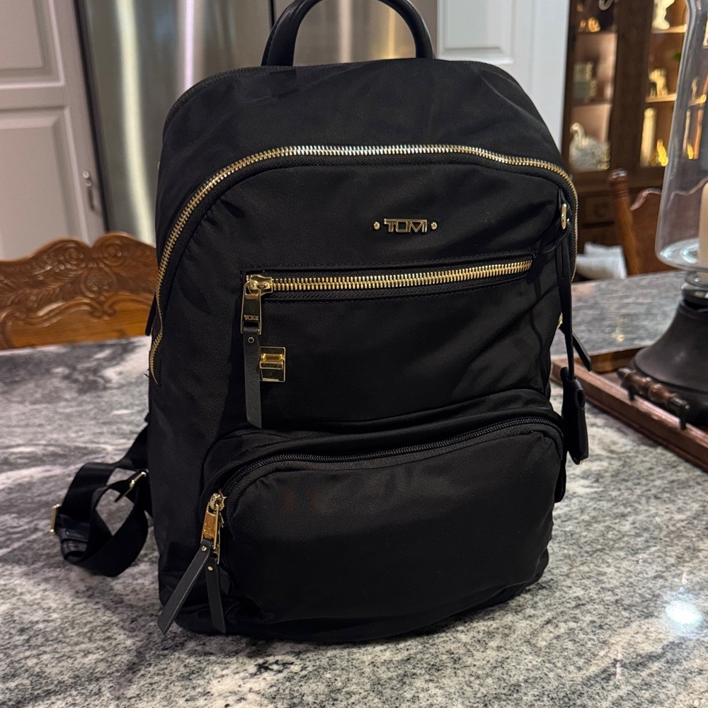 Tumi Black Backpack with Gold Accents